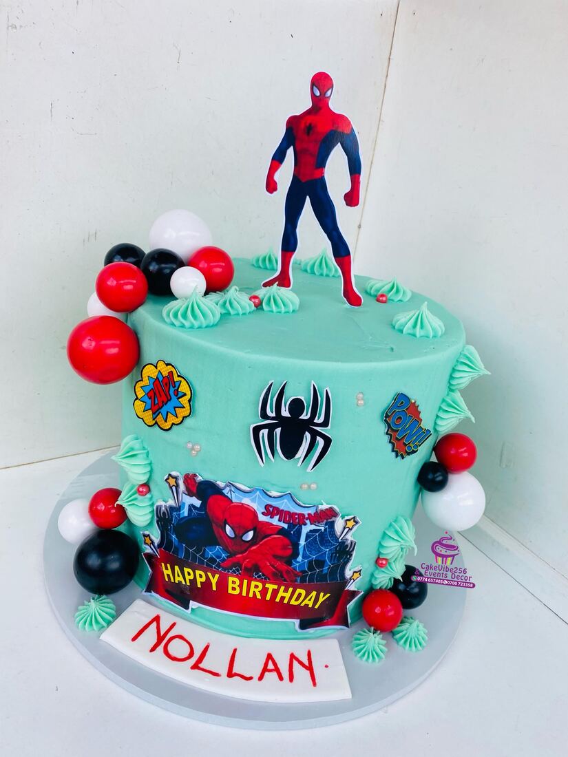 Spider-Man themed birthday cake with red and black balloons