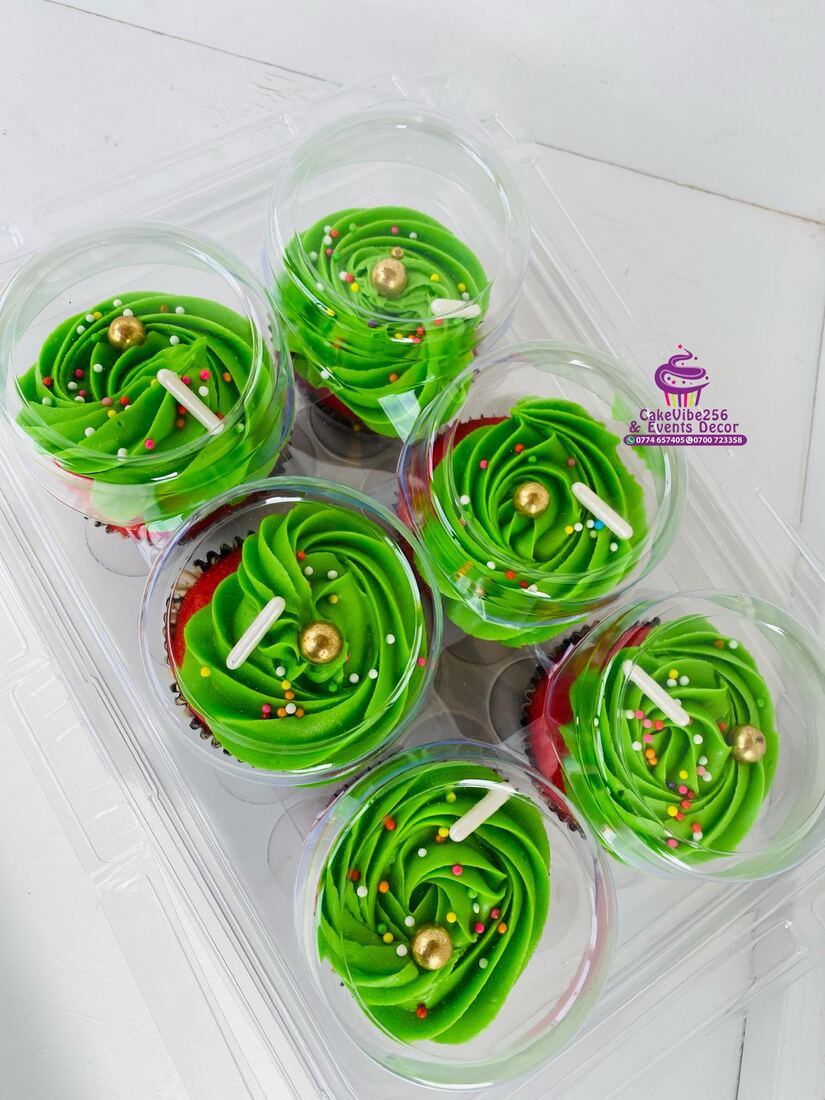 Boxed cupcakes with green swirl frosting and gold pearls, Kampala
