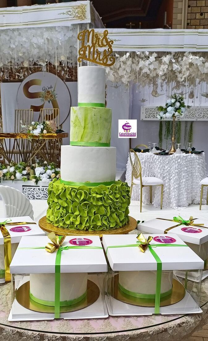 Green ruffle and white wedding cake with Mr and Mrs topper, Kampala