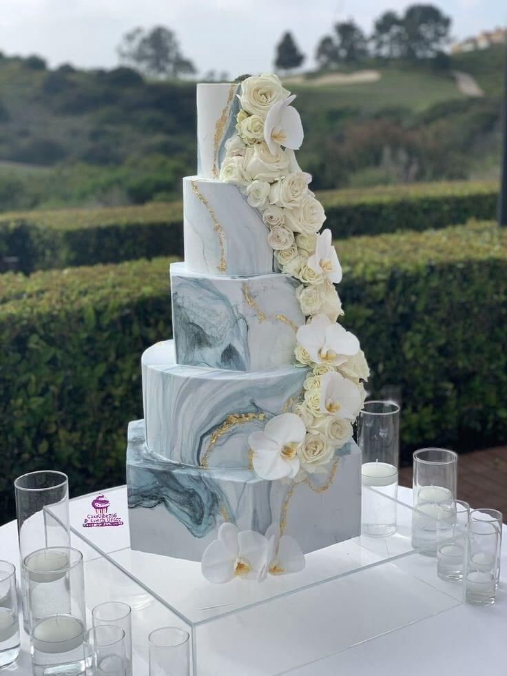 Tall marble and white orchid wedding cake, Kampala